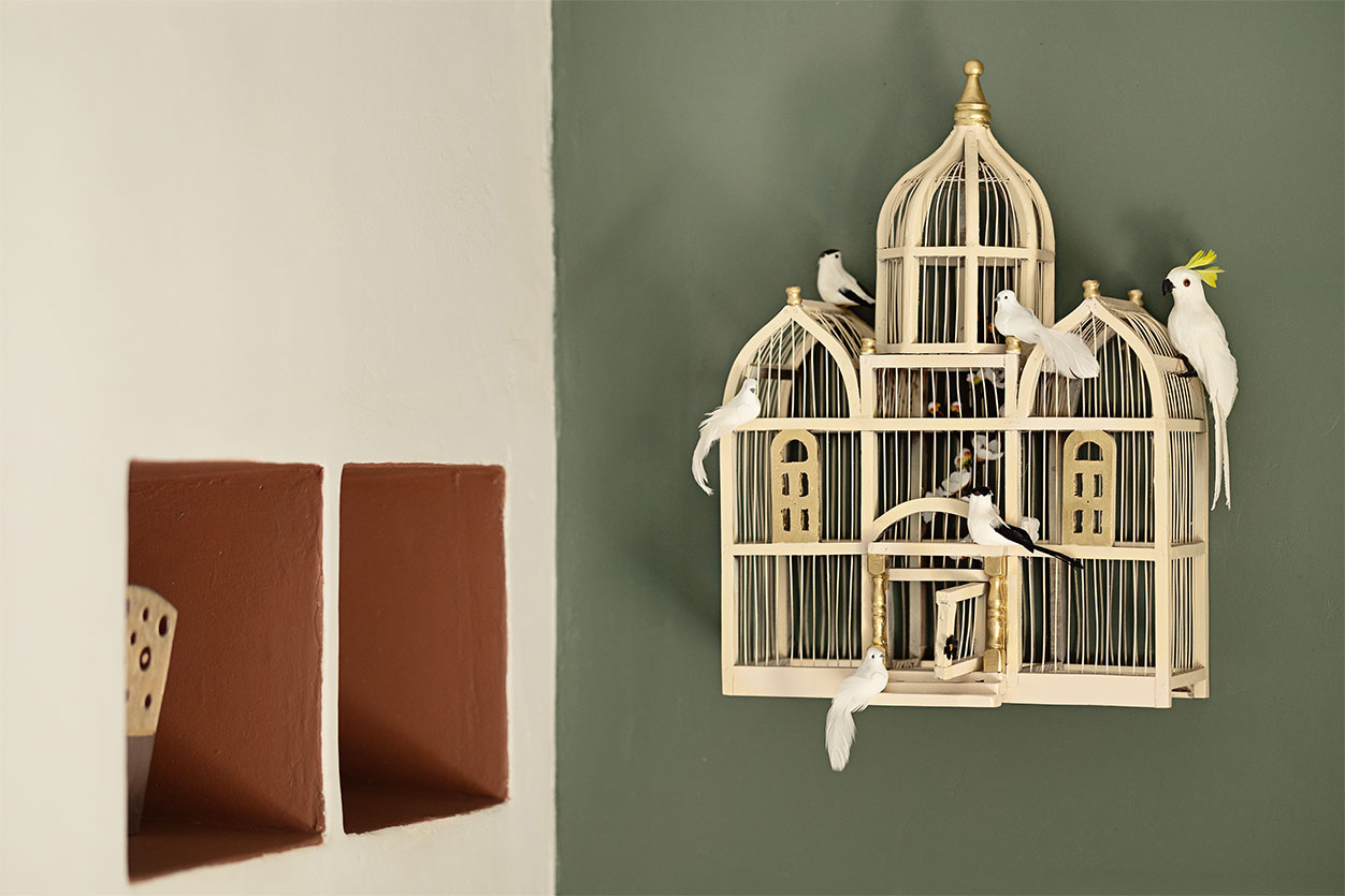 A decorative white birdcage accentuating the quirky, welcoming interior design of the boutique dog boarding facility in Johannesburg.