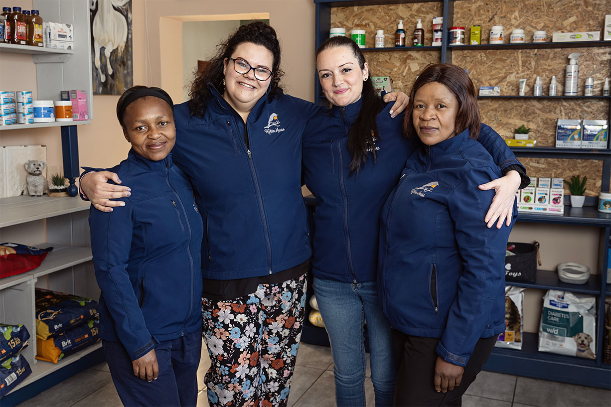 The dedicated exotic pet and rabbit boarding care team standing together inside The Robin House in Johannesburg.