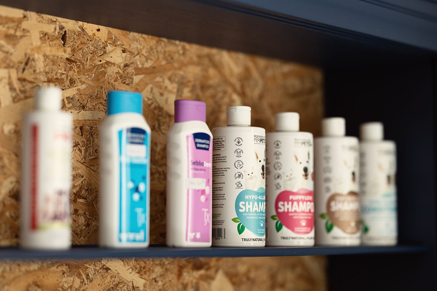 Natural and hypoallergenic pet grooming shampoos on display at the Essential Provisions vet shop in Benoni.