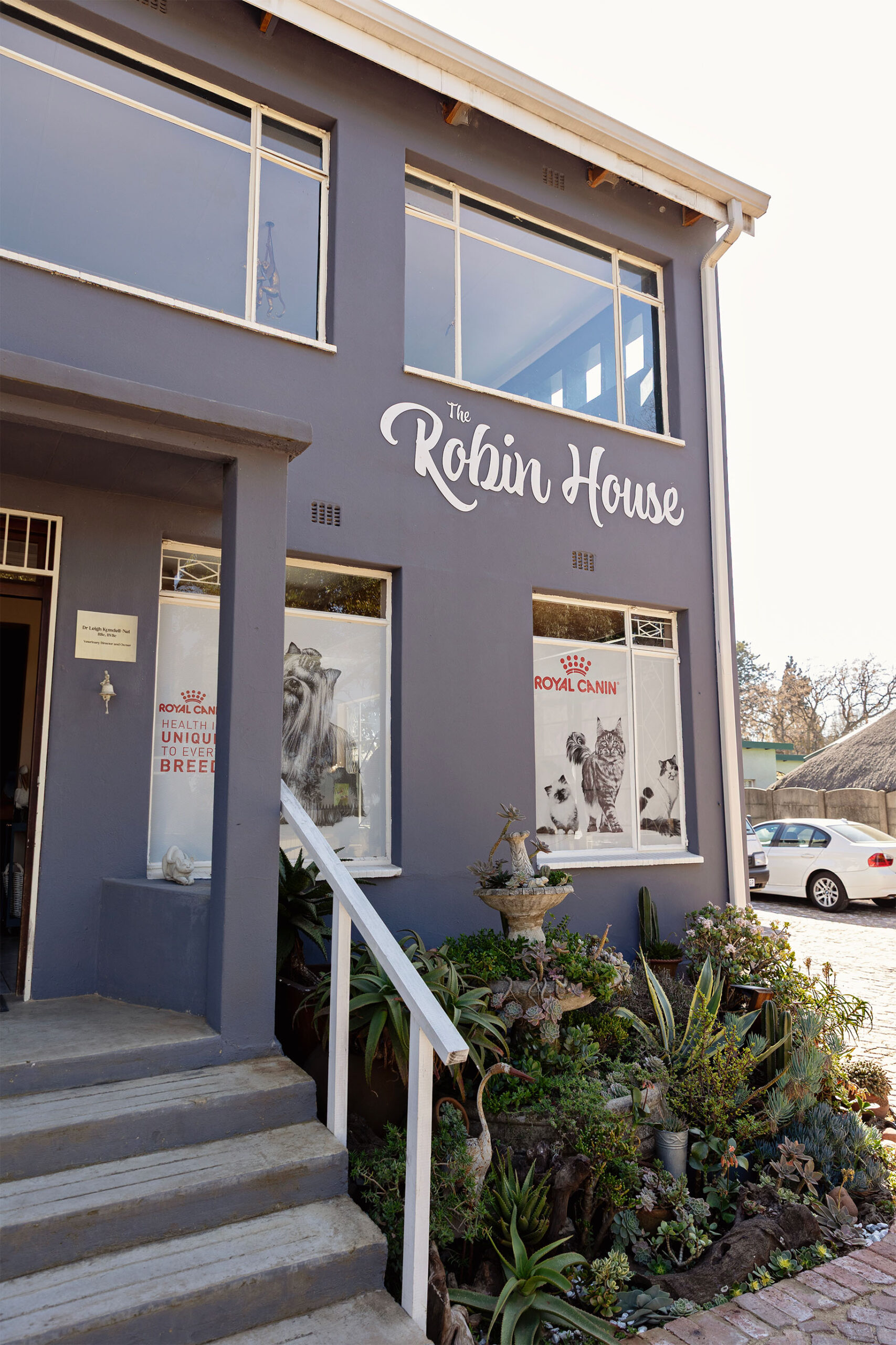 The front entrance of The Robin House veterinary clinic in Benoni, featuring a succulent garden and large front windows.