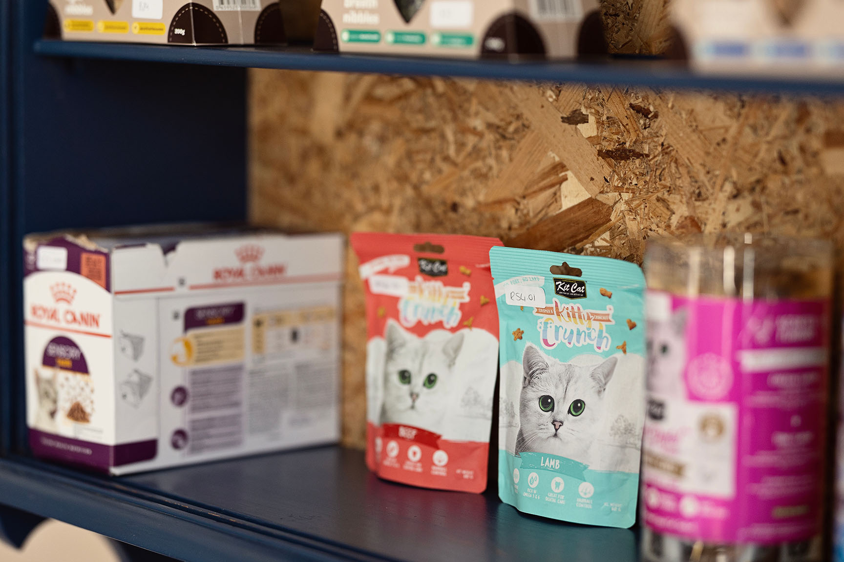 Kit Cat Kitty Crunch treats and feline provisions on the shelves at The Robin House vet shop in Benoni.